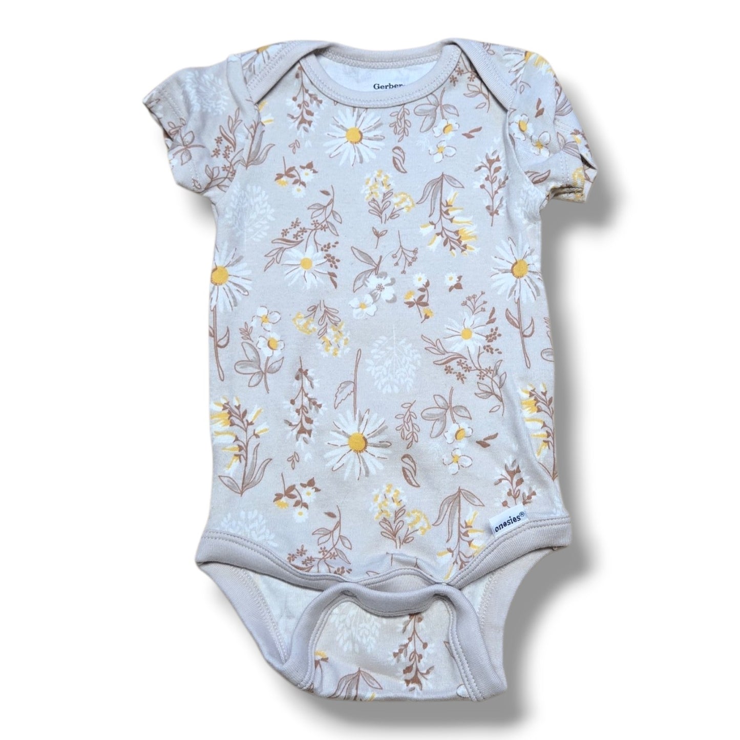 Pre-loved baby's bodysuit featuring a floral pattern, soft fabric, and easy snap closures for quick changes.