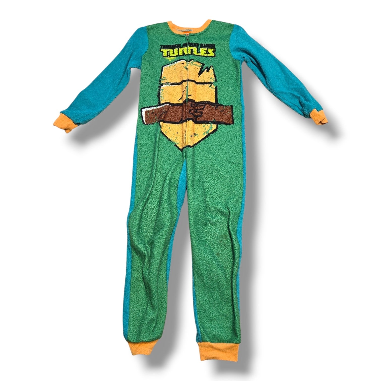 Pre-loved Nickelodeon TMNT sleeper displaying a fun shell design, perfect for cozy nights.