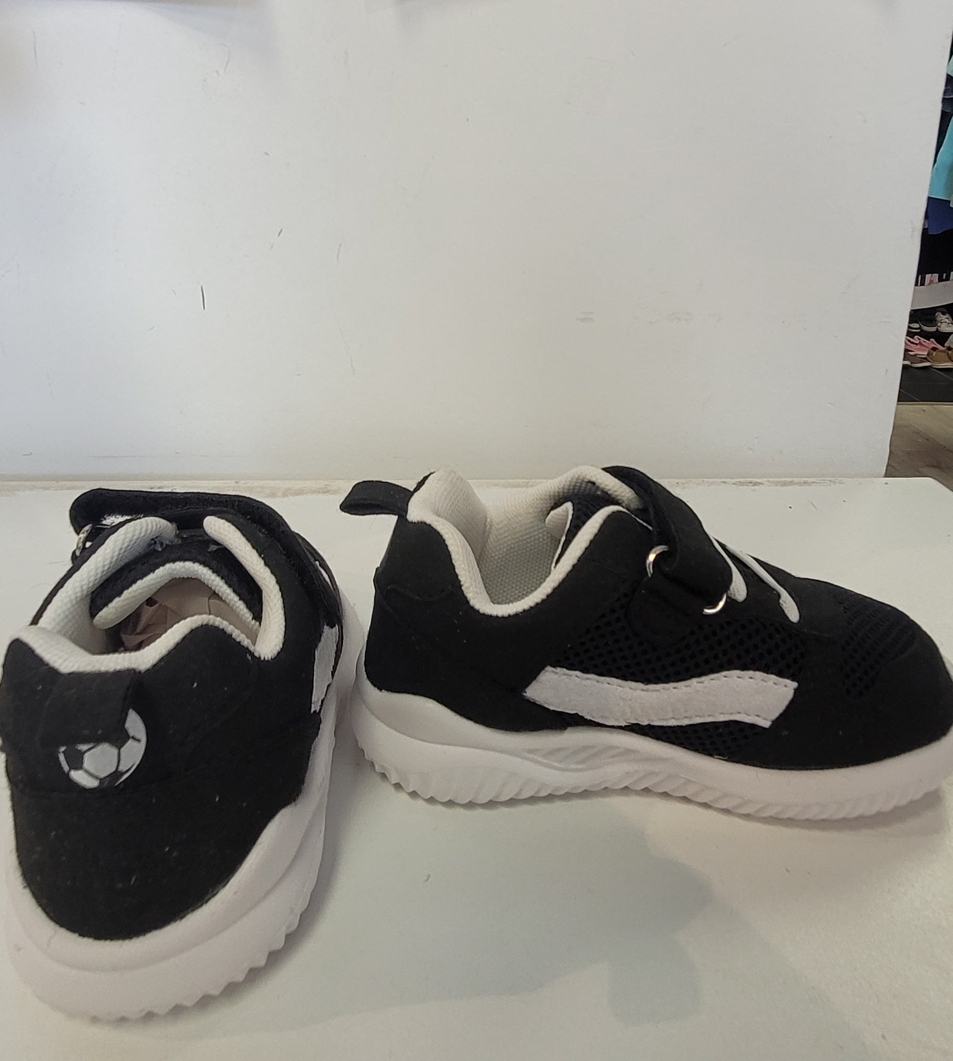 Lightweight EVA sneakers for kids in black and white, perfect for active children.