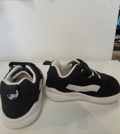 Lightweight EVA sneakers for kids in black and white, perfect for active children.