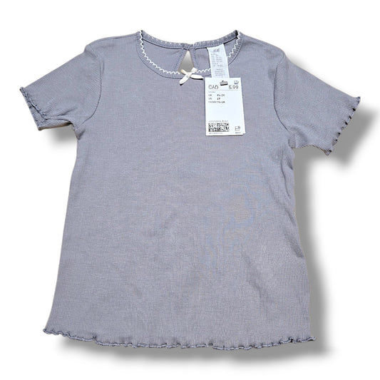 H&M half t-shirt NWT with retail tag showing price of $5.99, gray color and gently used condition.