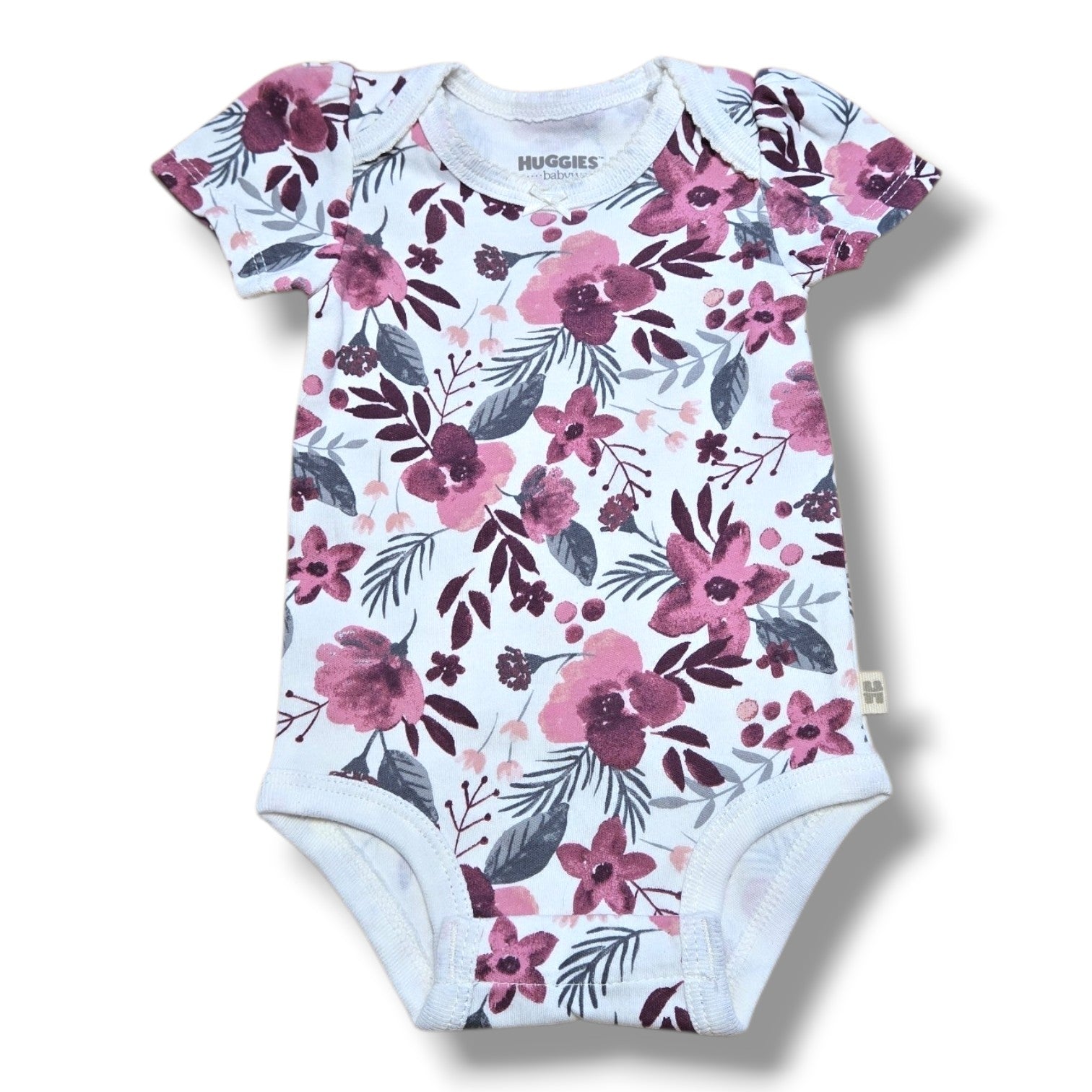 alt_tag: Huggies baby onesie in floral print, soft pre-loved baby onesie in mint condition, perfect for newborns.