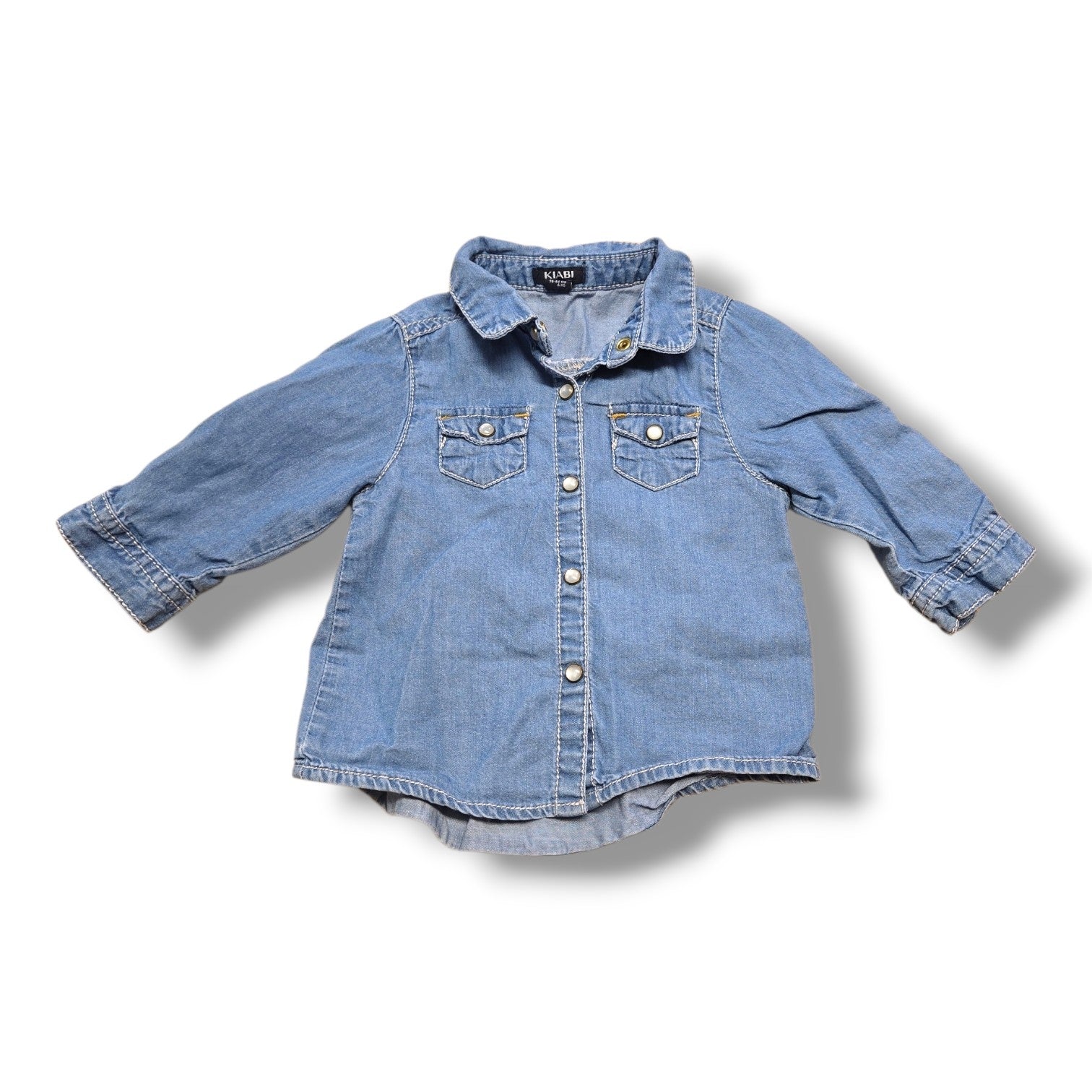 Kiabi pre-loved denim shirt for infants, 3 months size, featuring soft denim, snap buttons, and chest pockets.
