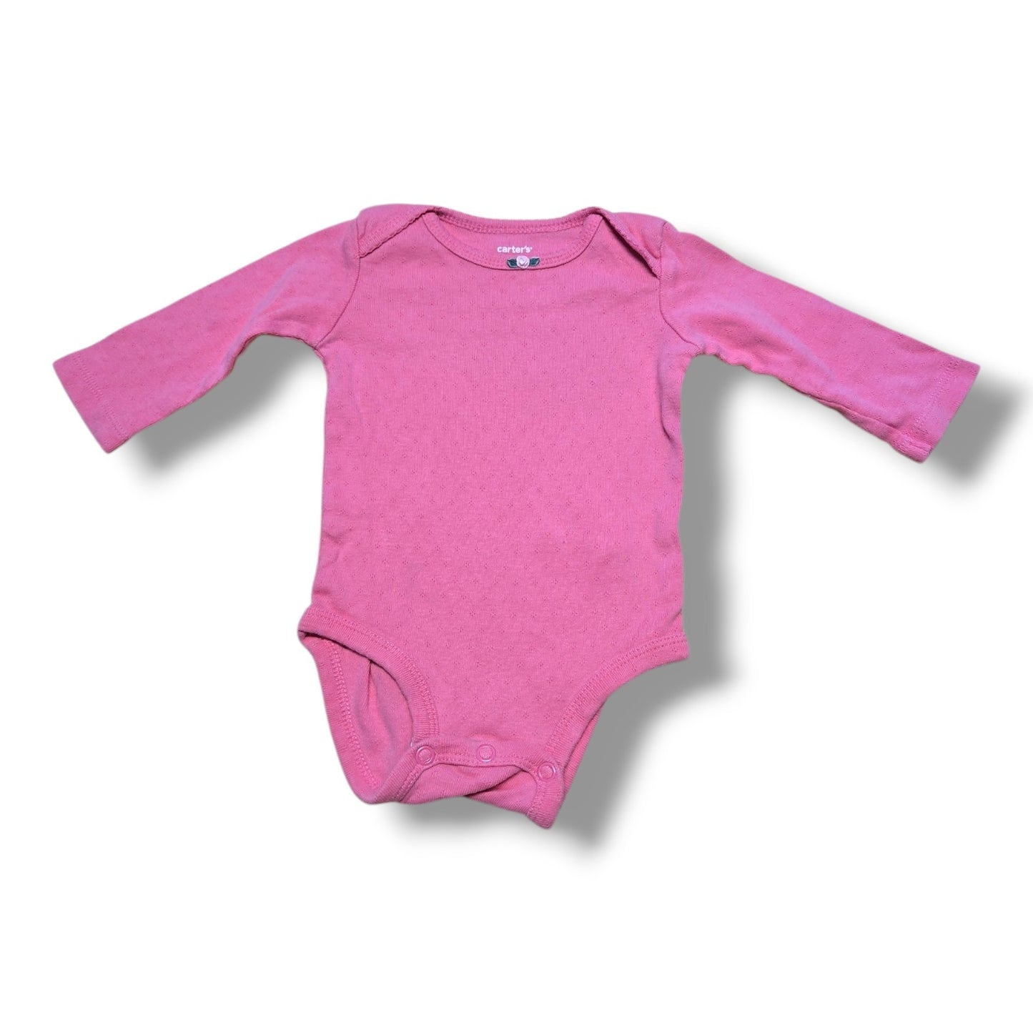 Pre-loved baby onesie in pink, soft and comfortable for everyday wear, featuring easy snap closures.