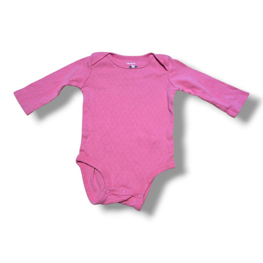 Pre-loved baby onesie in pink, soft and comfortable for everyday wear, featuring easy snap closures.