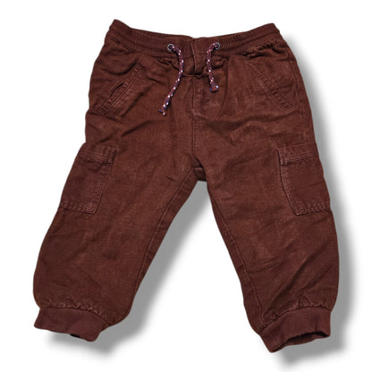 Stylish pre-loved Zara cargo joggers in rich rust brown color with elastic waistband and cuffed ankles.