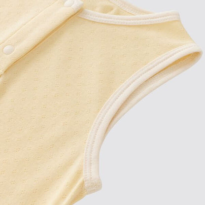 organic cotton sleeveless baby bodysuit in creamy yellow color, showcasing soft fabric and sleeveless design.