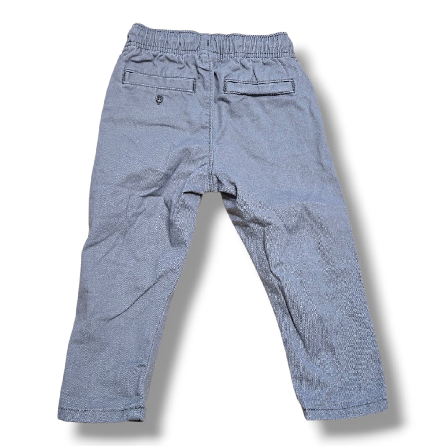 Back view of pre-loved Old Navy toddler pants in size 12-18 months, featuring elastic waistband and pockets.