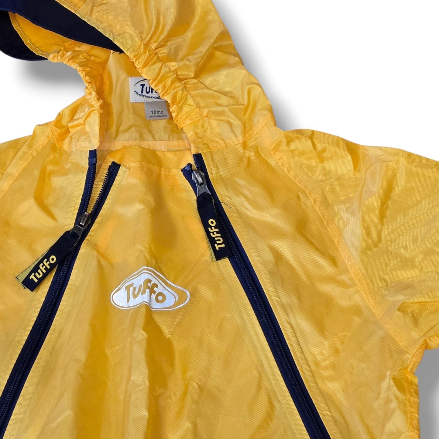 Pre-loved Tuffo waterproof rainsuit in bright yellow with navy accents, designed for outdoor adventures.