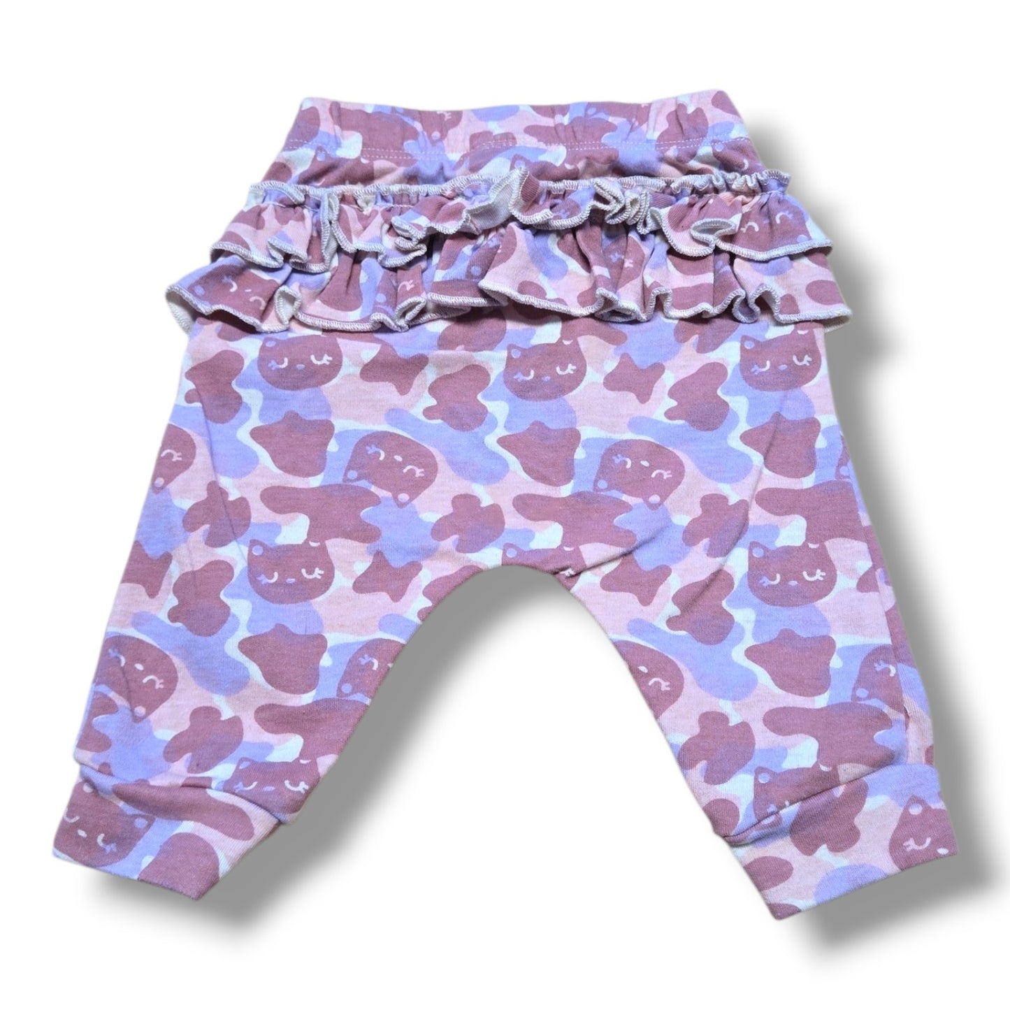 Pre-loved baby jogger pants in mauve camo print with ruffle details, size 0-3 months.