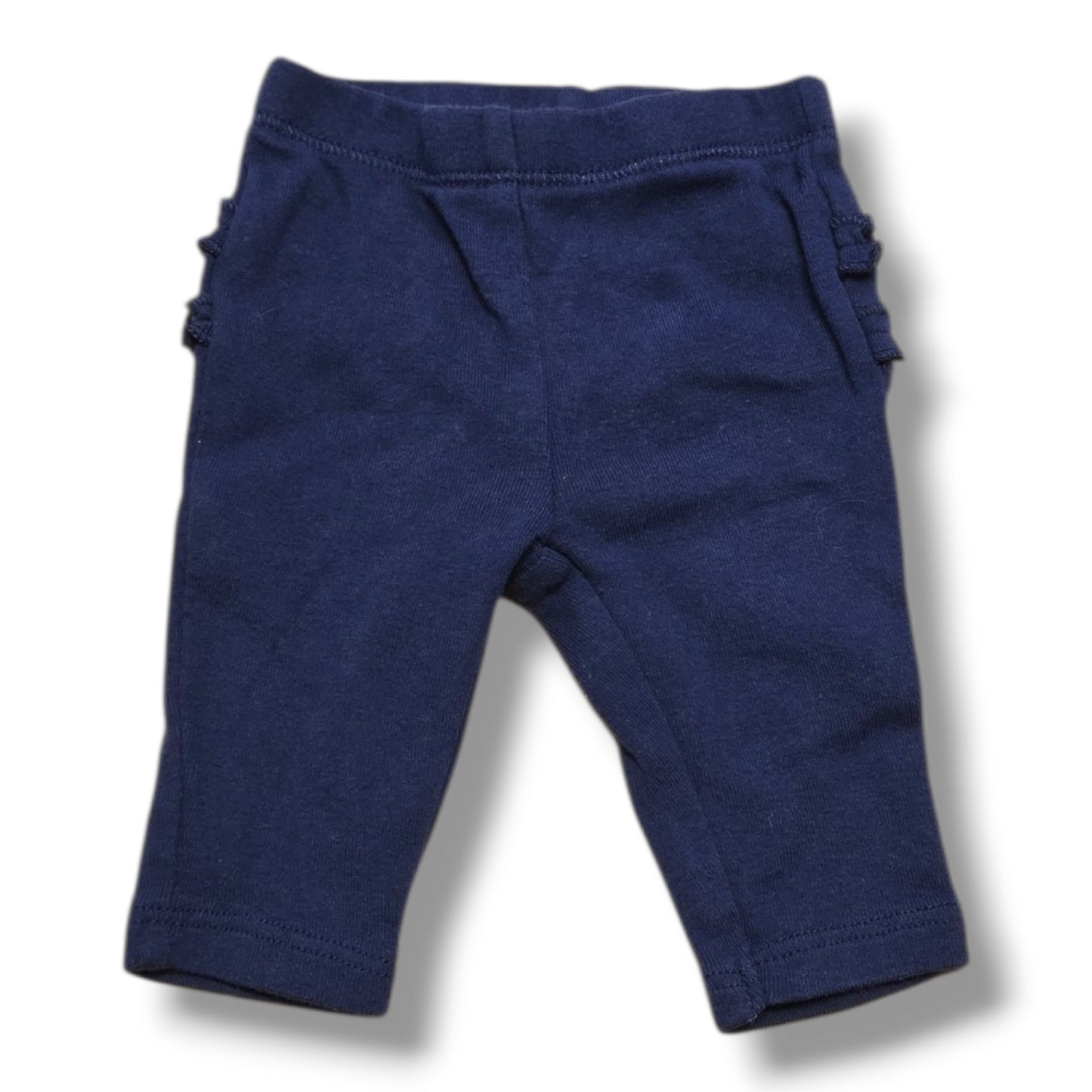 Carter's newborn ruffle pants in soft navy with ruffle details, preloved quality, perfect for your little one.