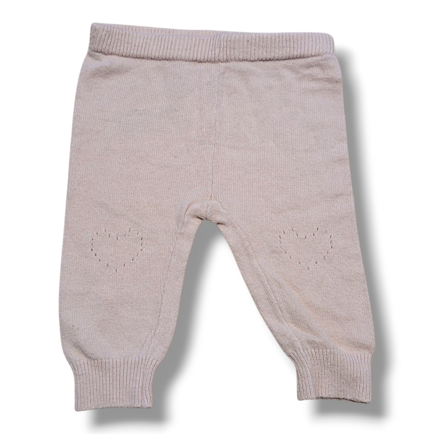 Pre-loved knit leggings for babies in size 0-3M with heart details on knees, mint condition.