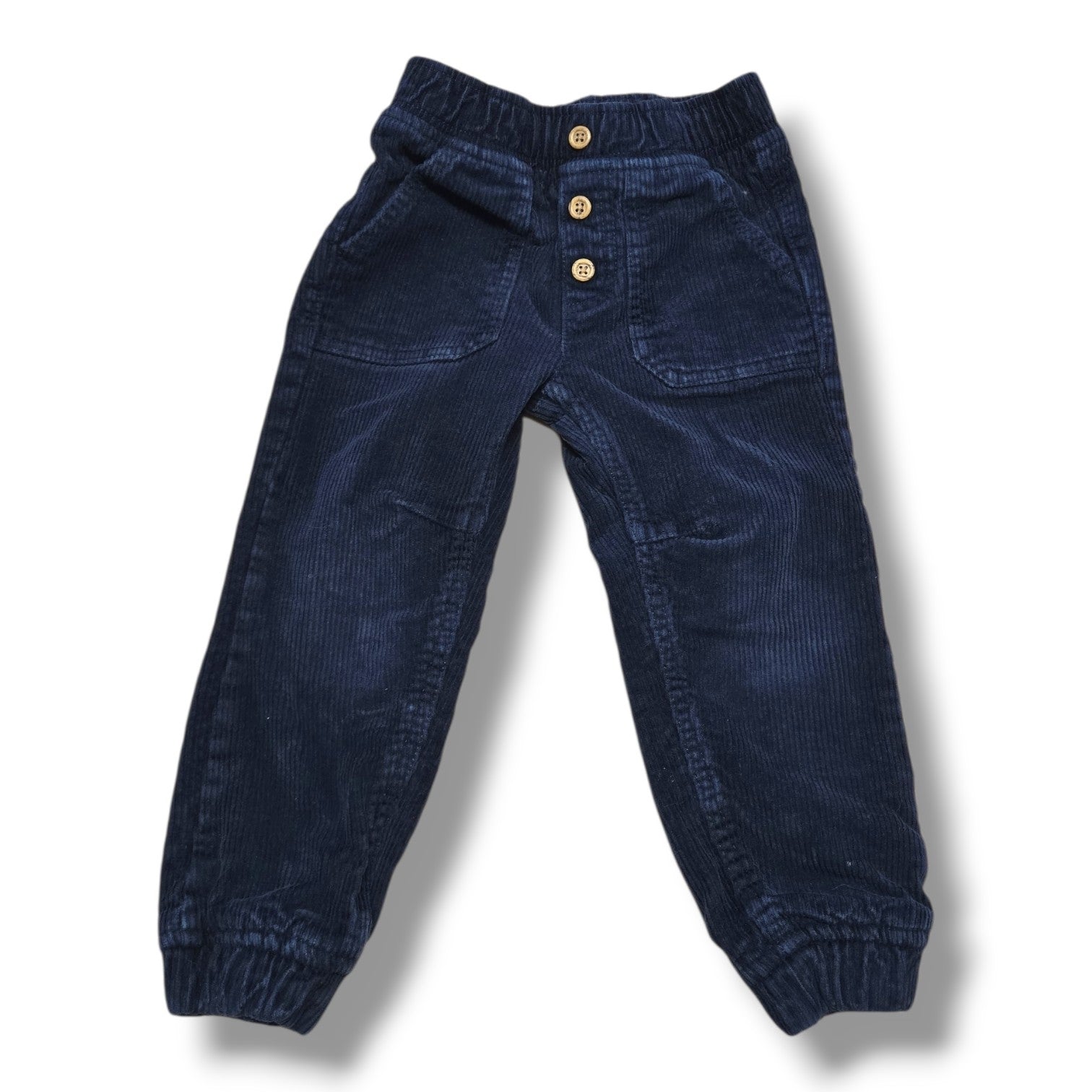 Joe Fresh preloved 3T corduroy joggers in navy with elastic waist, front pockets, and button detail.