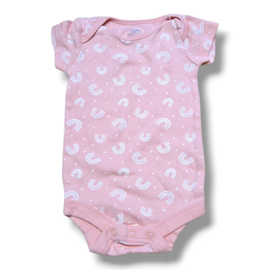 Pre-loved baby onesie in soft pink with white rainbow pattern and snap closures for easy changing.