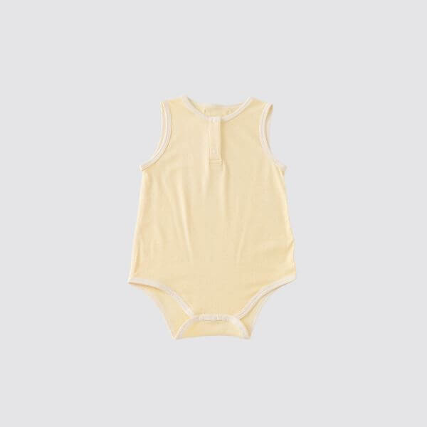 Organic cotton sleeveless baby bodysuit in creamy yellow, perfect for comfort and style in warm weather.