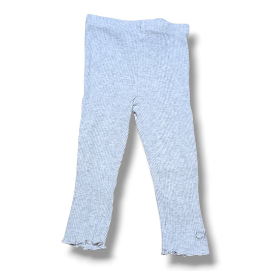 Pre-loved Calvin Klein capris in grey ribbed fabric, featuring a comfy waistband and ruffled hem detail.